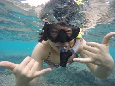 Woman posing while snorkeling at Aloha Adventures in Hawaii