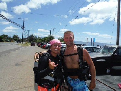 a man and women in scuba diving gear near sharks cove in Hawaii